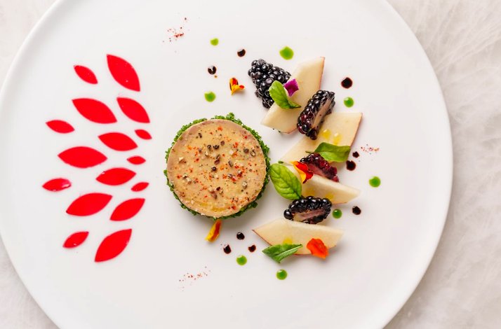 Artfully plated terrine with blackberries, pear slices, herbs, and red sauce accents at Le Jardinier Houston.