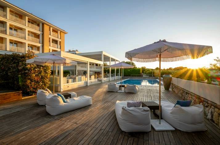 Loungers in front of the Hotel Vila Rova next to the outdoor pool.